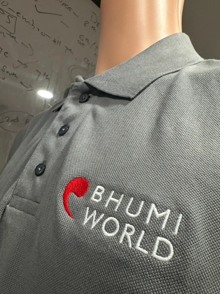 Grey polo with red logo for Bhumi World