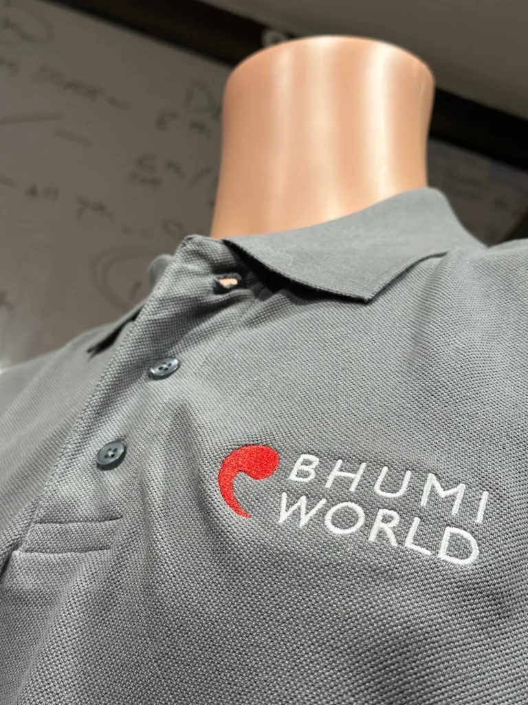 Grey polo with embroidered Bhumi World logo