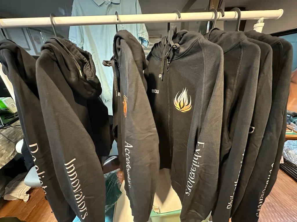 Batch of branded corporate hoodies on hangers
