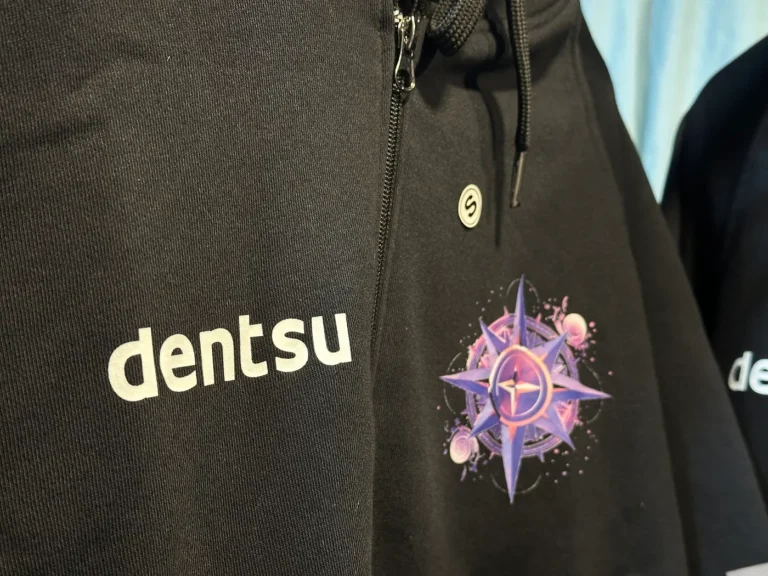 Dentsu black hoodie with printed artwork