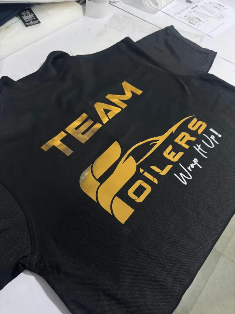 Black team polo with gold Foilers print