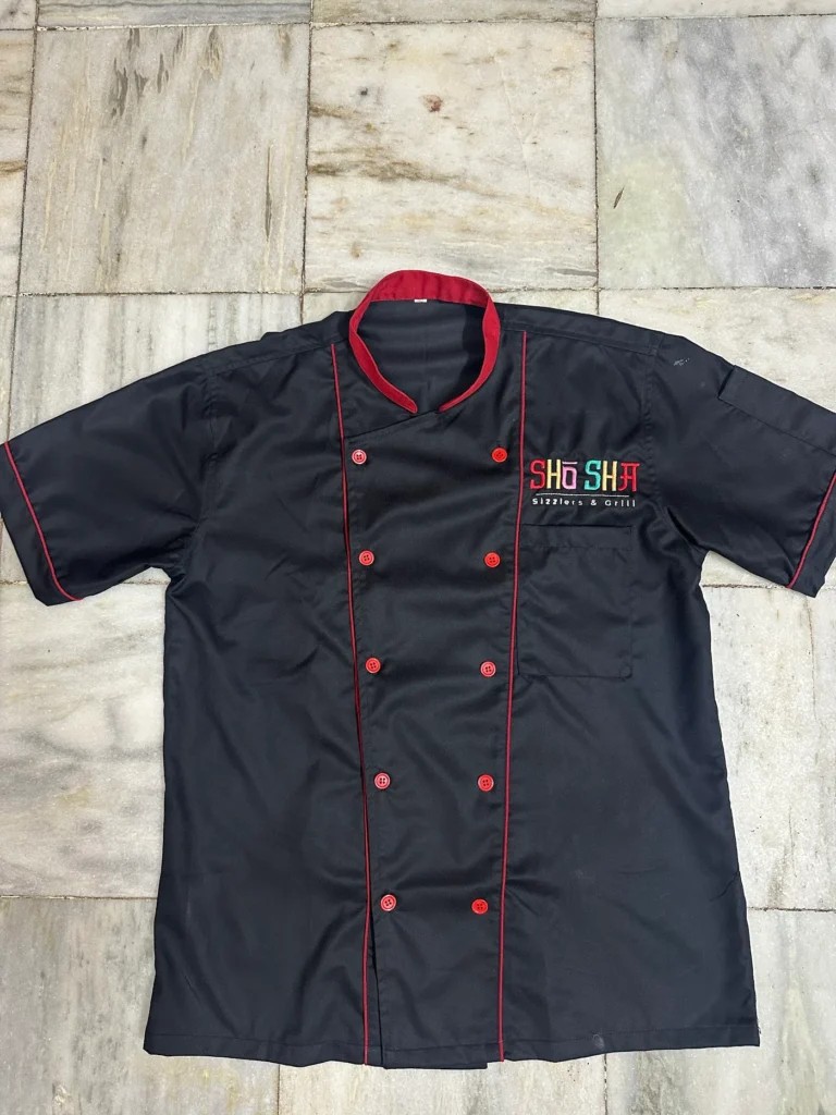 Black chef coat with multicolour embroidered Shosha logo