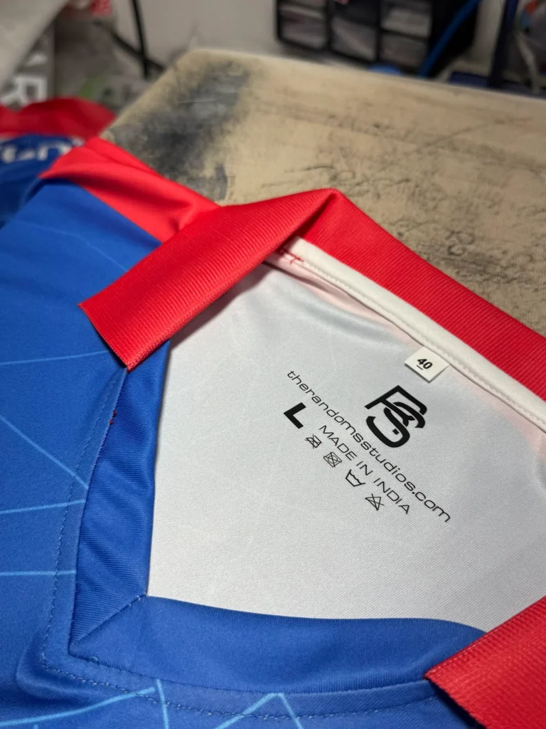 Sublimated blue jersey with printed neck label